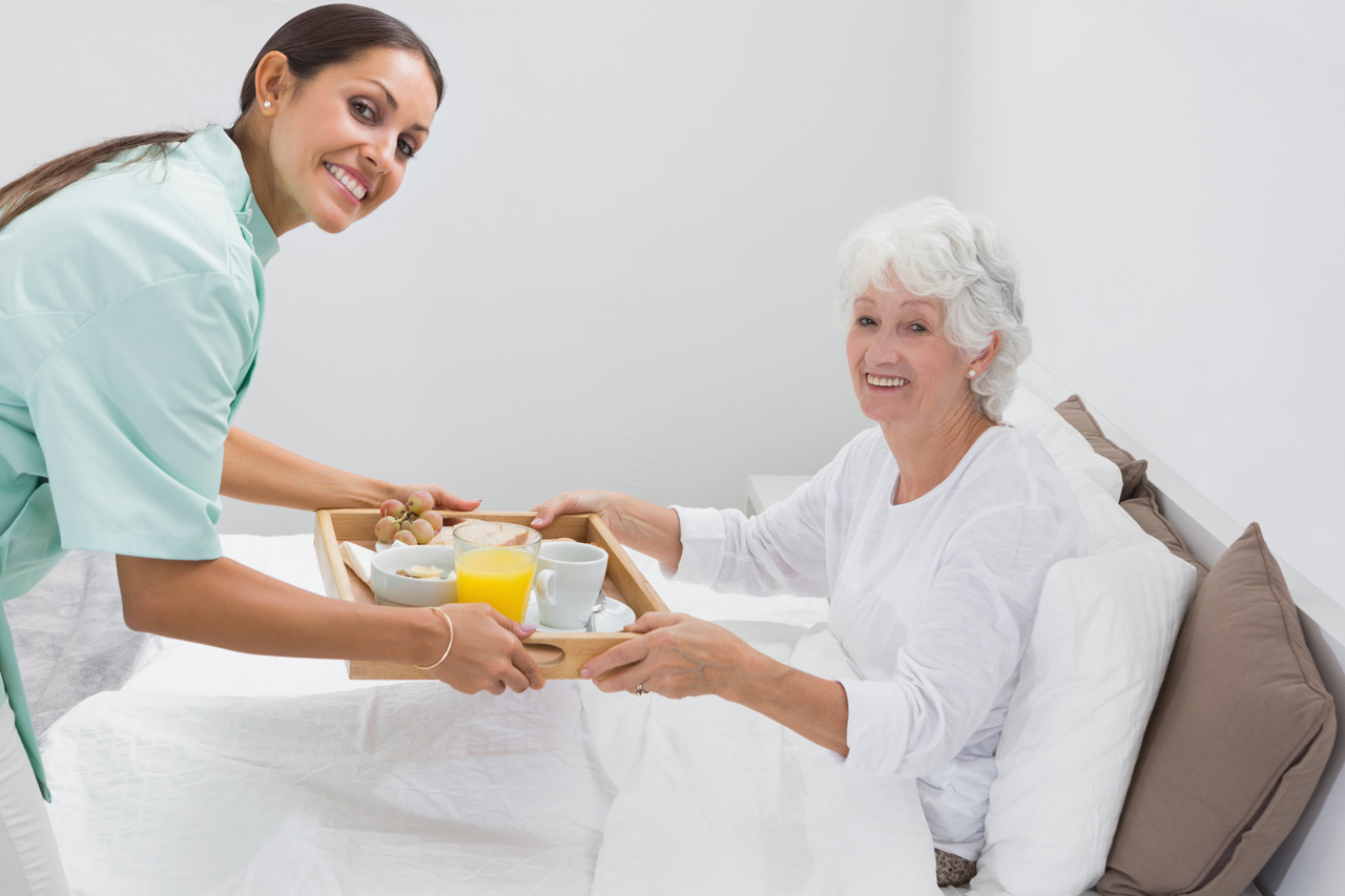 home-nurse-giving-a-breakfast-to-the-old-woman